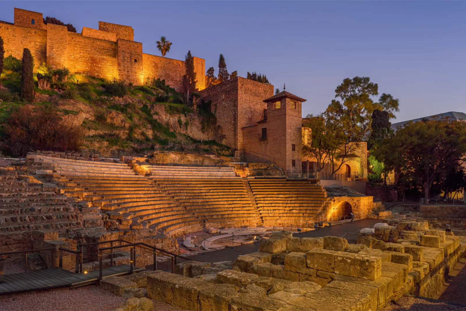 Things to do in Malaga, such as visit the pictured Roman amphitheatre at the foot of the Alcazaba.